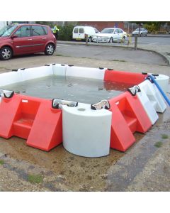 Flood barrier system using 0.5m corner multi-hub units to contain water in parking area